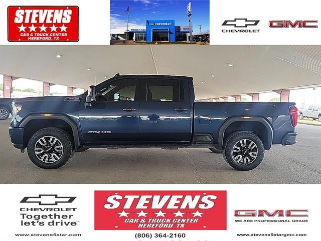 2022 GMC Sierra 2500 HD AT4 in Pacific Blue Metallic — front three-quarter view