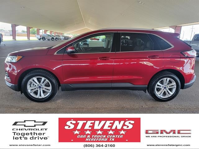 2019 Ford Edge SEL in Ruby Red Metall — front three-quarter view